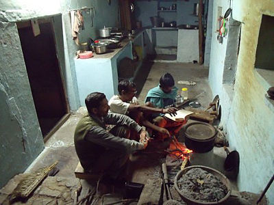 femme en cuisine tiers monde