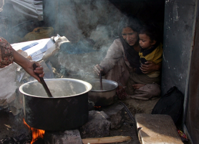 femme en cuisine tiers monde